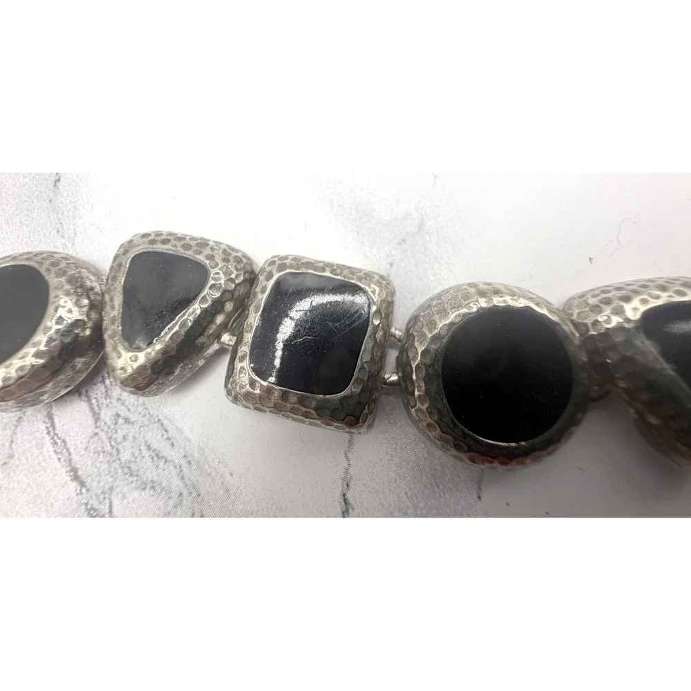 Source Unknown bold silver
